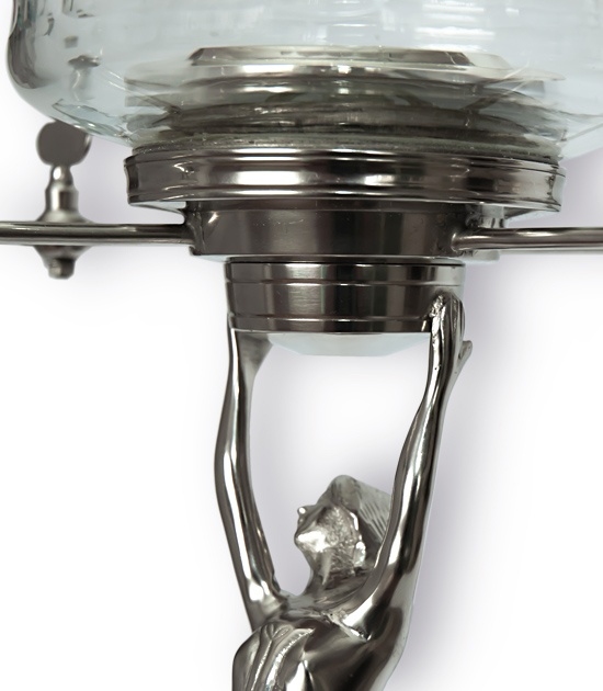 Deatailed view of the most famous absinthe fountain style. Lady holding the glass globe.