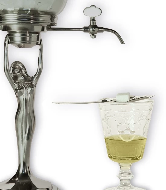 Detail of Versailles absinthe glass with absinthe, spoon, sugar and small absinthe fountain.