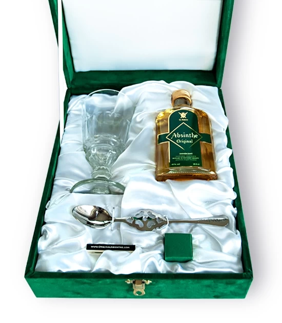 Opened luxury Absinthe Gift Box with absinthe spoon, absinthe glass, sugar cubes and box of matches.
