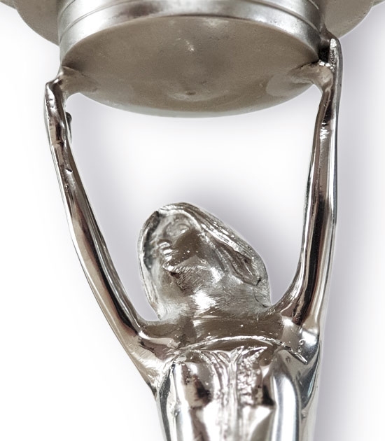 Detail of a lady holding the glass globe of absinthe mini fountain.
