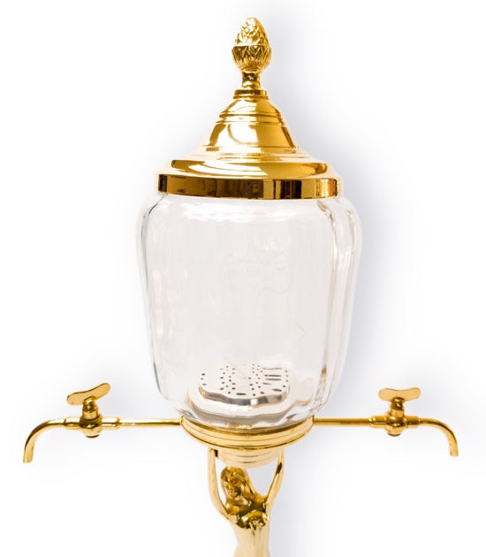 Small, golden absinthe fountain with two metal taps - detail of glass globe with Absinthe Original logo.
