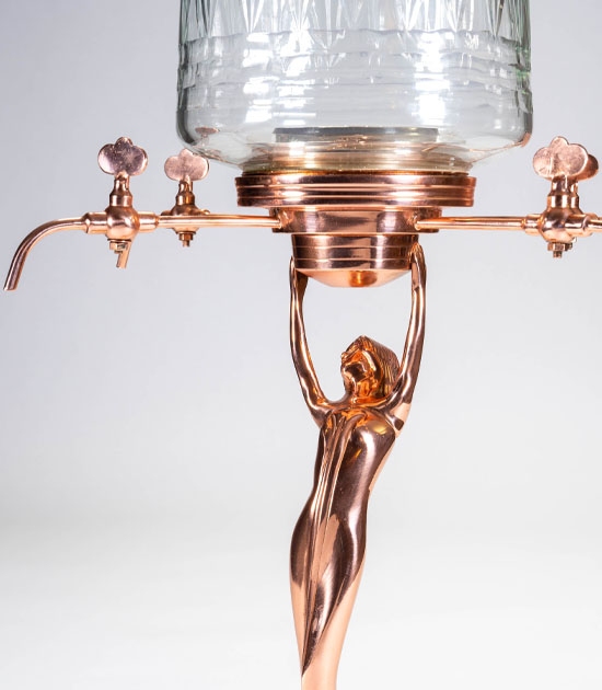 Handmade, mouth-blown glass, copper plating over brass with four taps.
