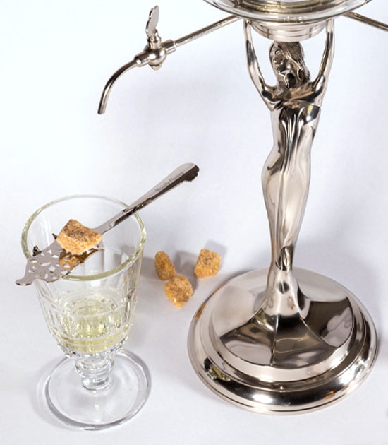 Wormwood absinthe spoon with Pontarlier absinthe glass and Lady Absinthe Fountain.