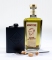 King of Spirits Gold Absinthe bottle with black hip flask and absinthe spoons Lautrec.
