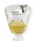 Absinthe keyring spoon sitting on a rim of Perigord absinthe glass