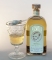 Absinthe spoon with sugar and old bottle of wormwood absinthe King of Spirits Gold.